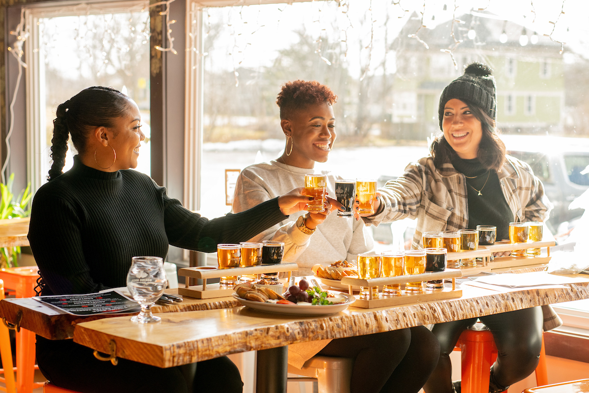 Three women toasting at Boxing Rock Brewing Co.