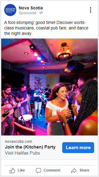 Two women in a pub with three musicians in the background