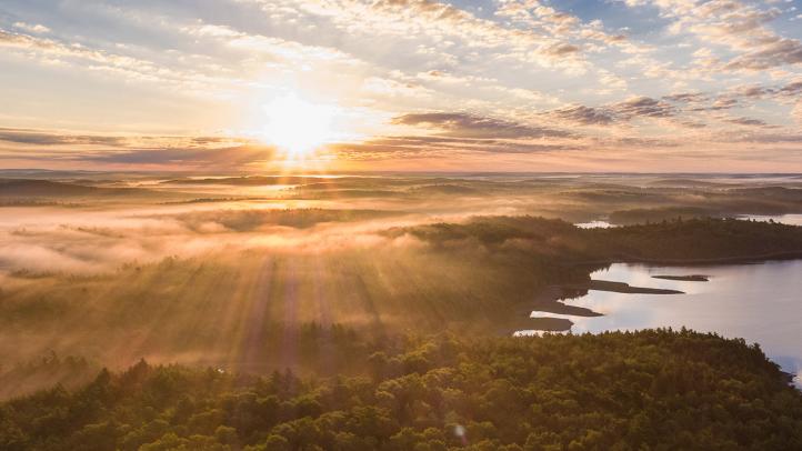 Sunrise over lake and forest at Kejimkujik National Park