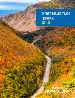 Road winding through Cape Breton Highlands covered in fall foliage. Blue text box reads Export Travel Trade Program 2024-25.